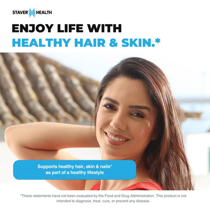 Smiling woman with long, shiny brown hair on a sunny day